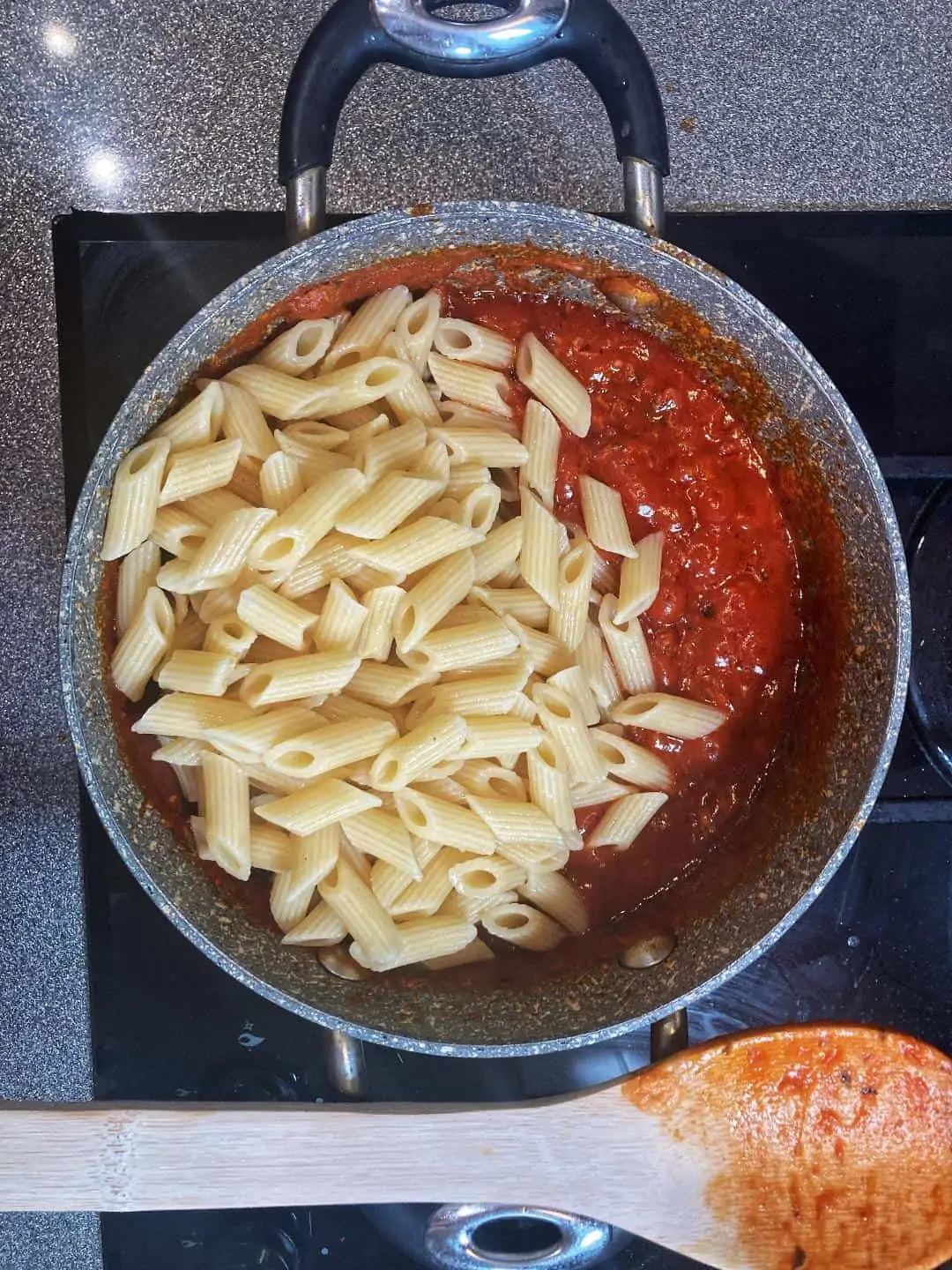add cooked penned pasta to the tuna sauce