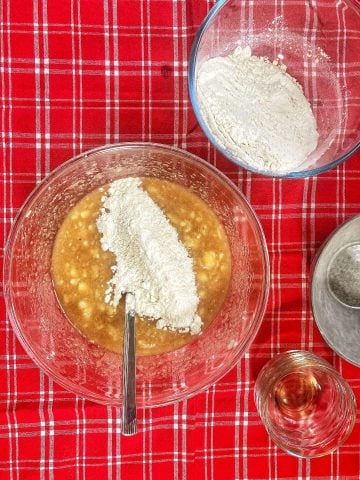 add flour a bit at a time