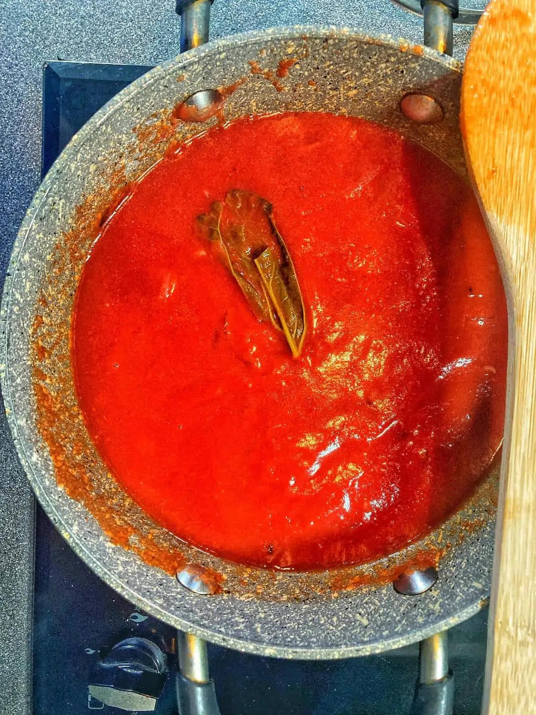 basil and tomato sauce for eggplant parmesan recipe top of baked eggplant parmesan