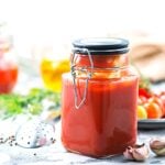 Homemade Tomato puree in a glass jar.
