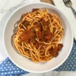 Plate of Spaghetti alla puttanesca sauce.