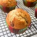 Banana chocolate chip muffin on a cooling rack.