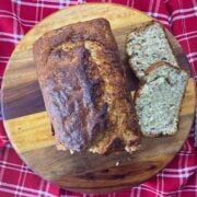 Slices of banana bread on a wooden block.