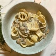 Bowl of mushroom pappardelle with garlic sauce.